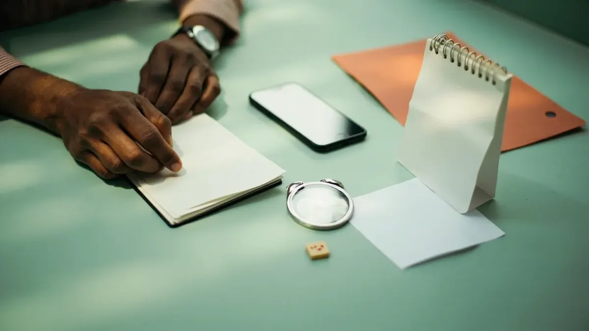 User reviewing a withdrawal process beside a closed bank passbook